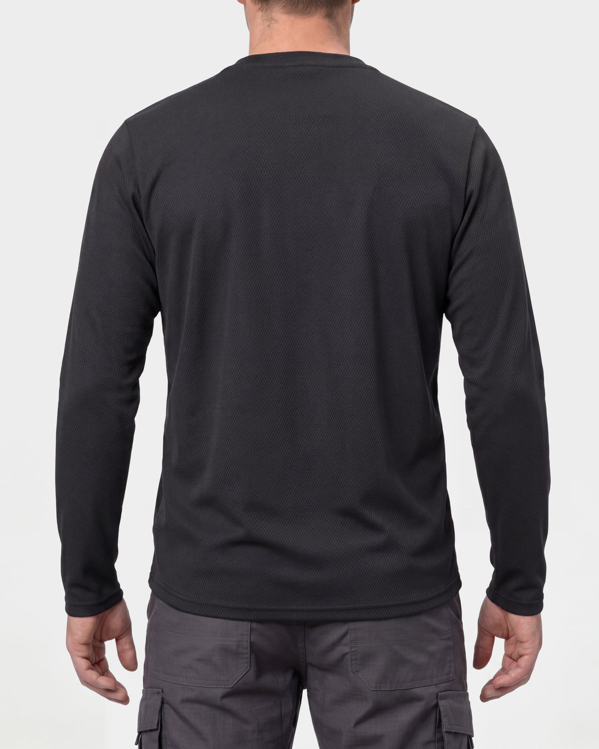 A model wears the STRAUSS Performance Long Sleeve Shirt in black