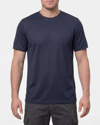 A model wears the STRAUSS Performance T-Shirt in nero blue in a studio product scene