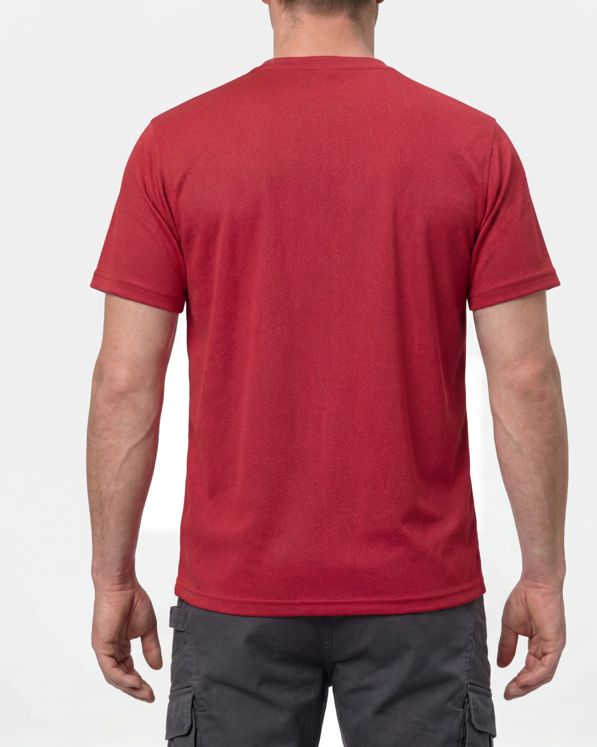 A model wears the STRAUSS Performance T-Shirt in fire red, showing the shirt fit