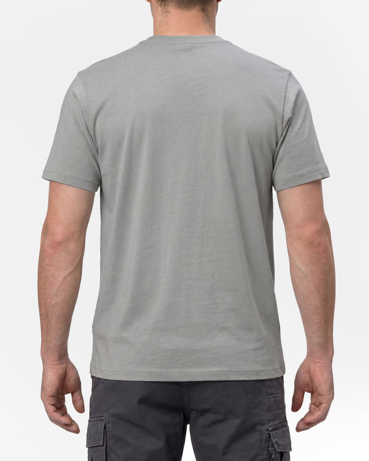 A model wears the STRAUSS T-Shirt e.s.concrete in pearl gray with work pants and work boots, showing the shirt fit