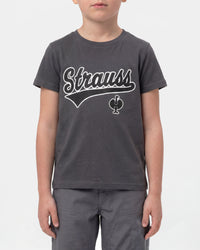 A child wears the Kids' STRAUSS Artwork T-Shirt e.s.e:pic in carbon gray with casual workwear pants in a studio product scene
