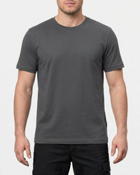 A model wears the STRAUSS Cotton Stretch T-Shirt in carbon gray with in a studio product scene