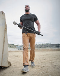 Lifestyle view of Chino Pants e.s.e:pic in almond brown during work