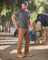 Lifestyle view of Twill Cargo Work Pants e.s.e:pic in almond brown during work
