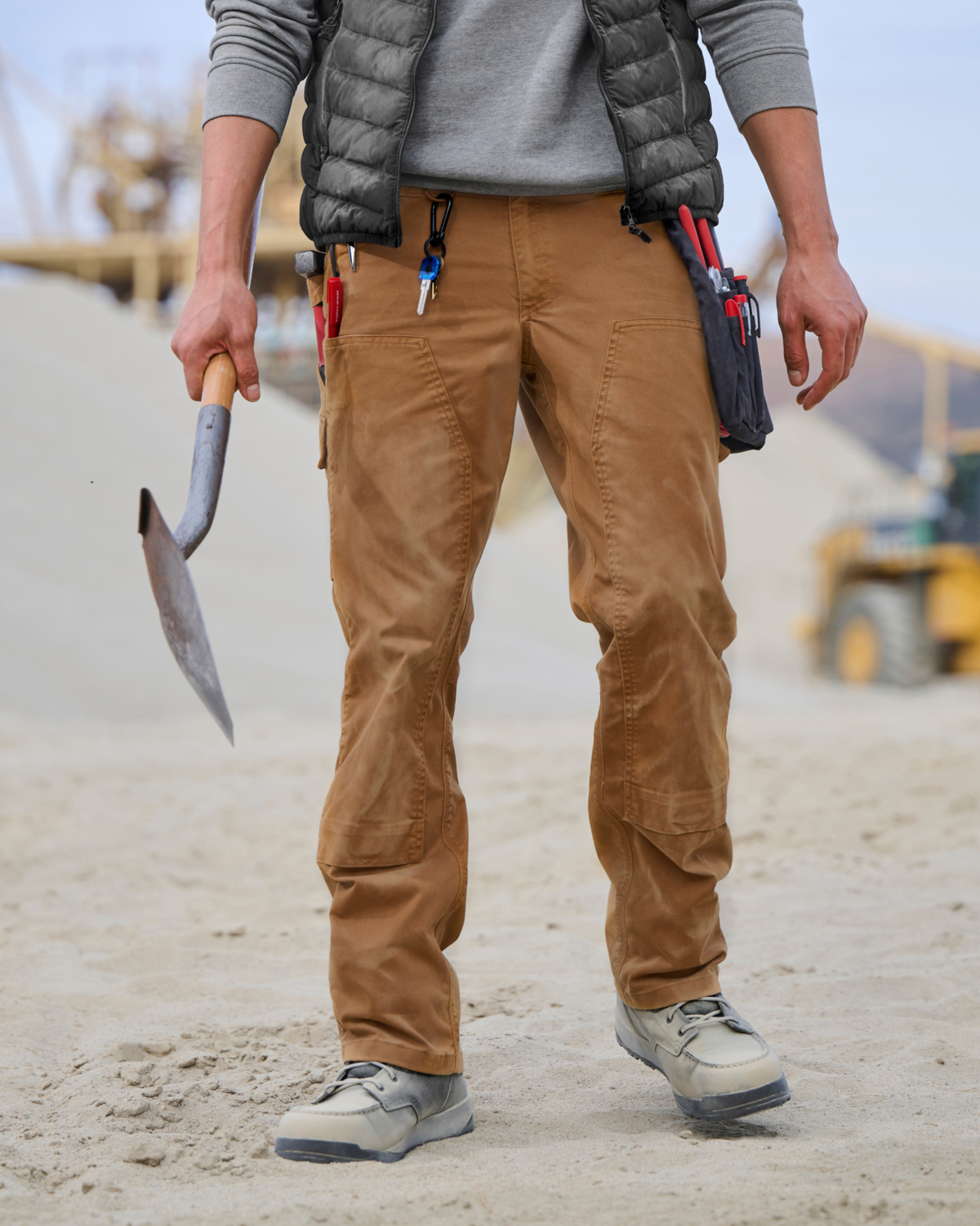 Double Front Twill Cargo Work Pants e.s.e:pic in almond brown worn in a work setting