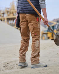Double Front Twill Cargo Work Pants e.s.e:pic in almond brown shown in an outdoor workwear setting