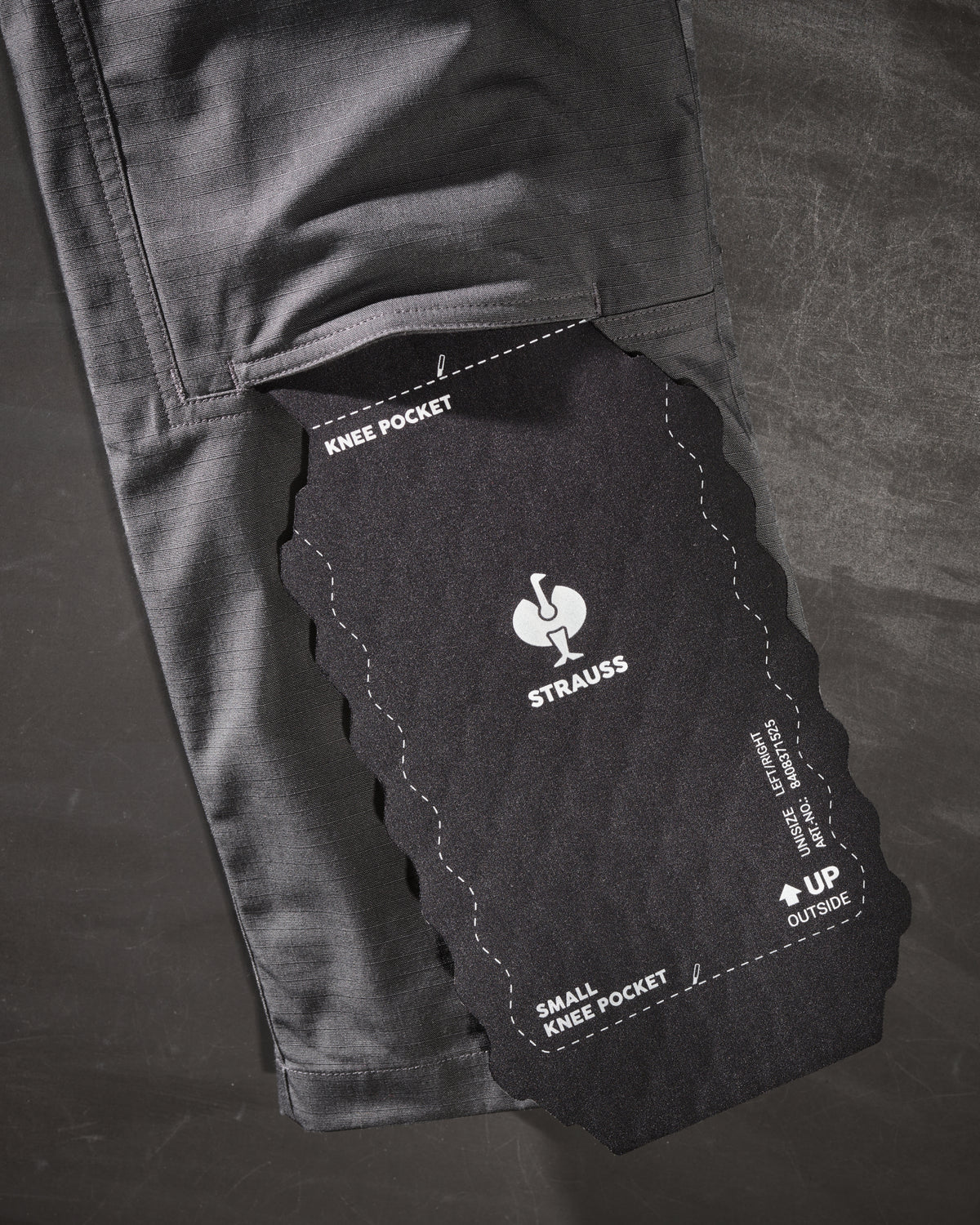 Close-up of knee pad pocket details on Double Front Ripstop Cargo Work Pants e.s.e:pic in carbon gray