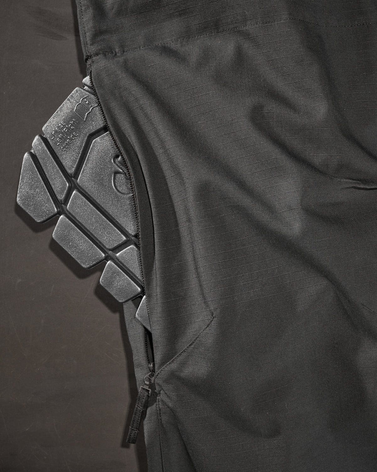 Close-up of knee pad pocket details on Women's Ripstop Cargo Work Pants e.s.e:pic in black