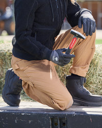 Women's Double Front Ripstop Cargo Work Pants e.s.e:pic in almond brown shown in an outdoor workwear setting