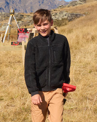 STRAUSS kids' e.s.e:pic sherpa fleece jacket in black in use on the job
