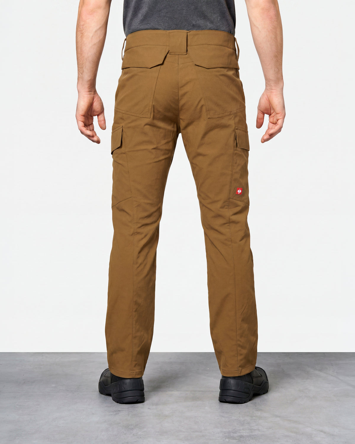 Stretch Ripstop Cargo Work Pants e.s.taktik in desert brown worn by a model, rear view