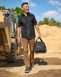 Lifestyle view of Stretch Ripstop Cargo Work Pants e.s.taktik in desert brown during work