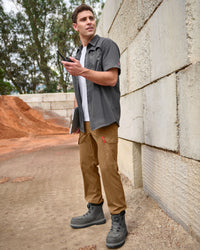 Stretch Ripstop Cargo Work Pants e.s.taktik in desert brown shown in an outdoor workwear setting
