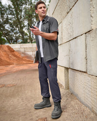 Stretch Ripstop Cargo Work Pants e.s.taktik in nero blue shown in an outdoor workwear setting