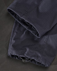 Close-up of adjustable hem pocket details on Stretch Ripstop Cargo Work Pants e.s.taktik in nero blue