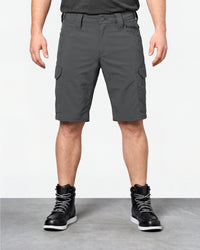 Model wearing Engelbert Strauss e.s. taktik stretch ripstop cargo work shorts in carbon gray, showing the fit, length, waistband, and front pocket layout of the durable stretch ripstop cargo work shorts with utility pockets.