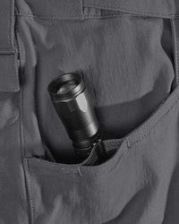 Close-up detail of Engelbert Strauss e.s. taktik stretch ripstop cargo work shorts in carbon gray, focusing on the utility pocket area, seams, and reinforced workwear construction.