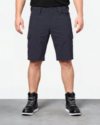 Model wearing Engelbert Strauss e.s. taktik stretch ripstop cargo work shorts in nero blue, showing the fit, length, waistband, and front pocket layout of the durable stretch ripstop cargo work shorts with utility pockets.