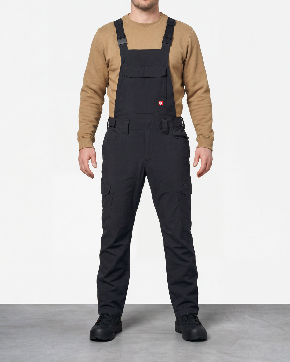 black STRAUSS Stretch Ripstop Cargo Work Bib Overall e.s.taktik worn by a model, front view