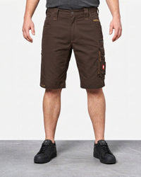 A person wearing dark brown cargo shorts with side utility pockets, paired with black sneakers, shown from the waist down against a light gray studio background.