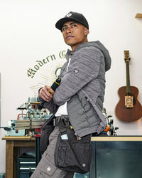 STRAUSS e.s.motion ten hybrid hooded jacket in gray melange shown during outdoor work