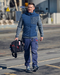 STRAUSS e.s.motion ten hybrid hooded jacket in slate blue melange shown during outdoor work