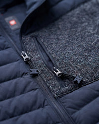 Close-up of quilted and stretch panel details on STRAUSS e.s.motion ten hybrid hooded jacket in slate blue melange