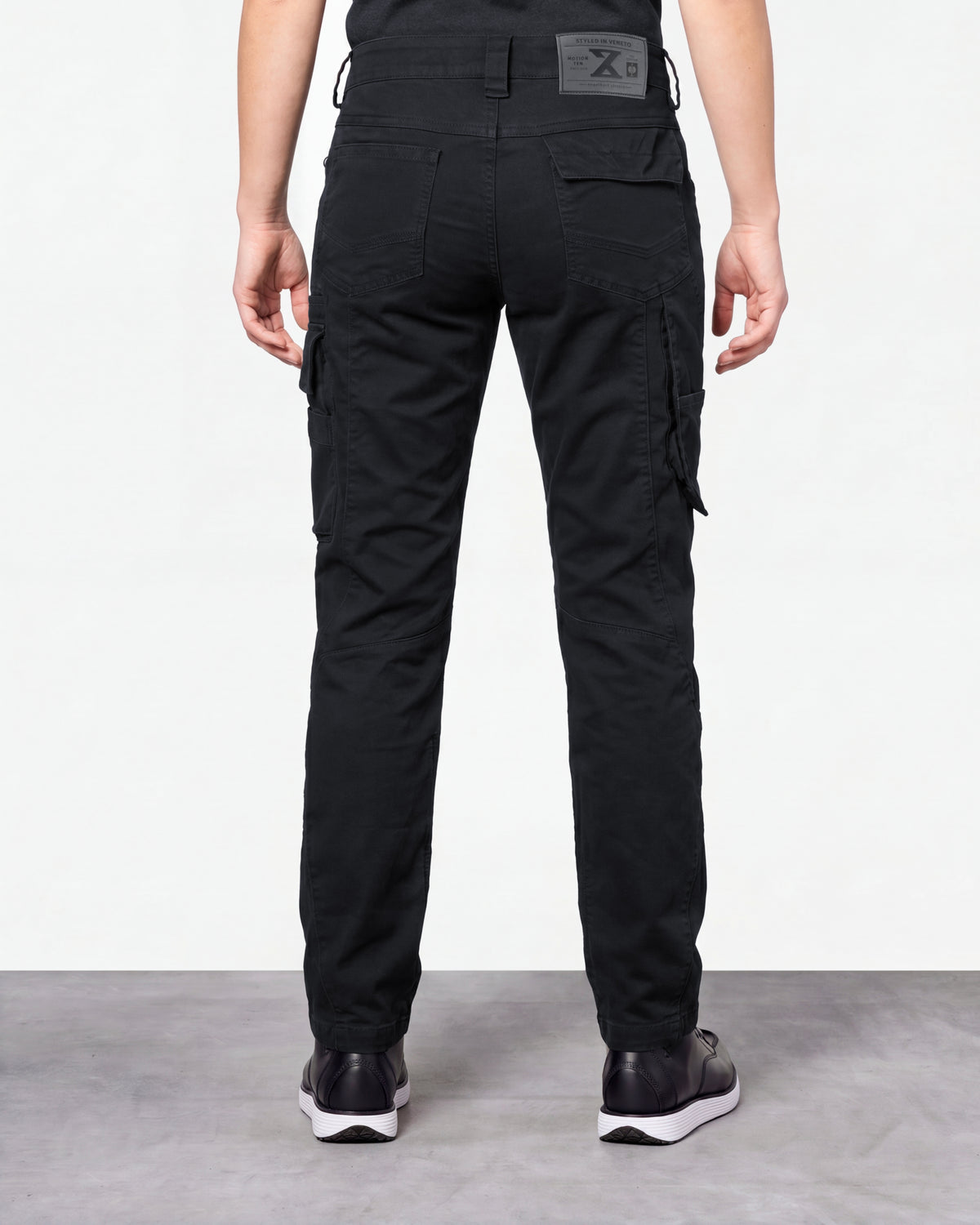 Women's Cargo Work Pants e.s.motion ten in oxid black worn by a model, rear view