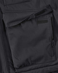 Close-up of zipper and pocket details on STRAUSS e.s.trail winter jacket in black