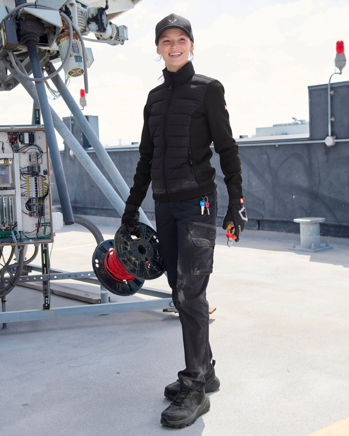 STRAUSS women's e.s.trail pure hybrid jacket in black in use on the job
