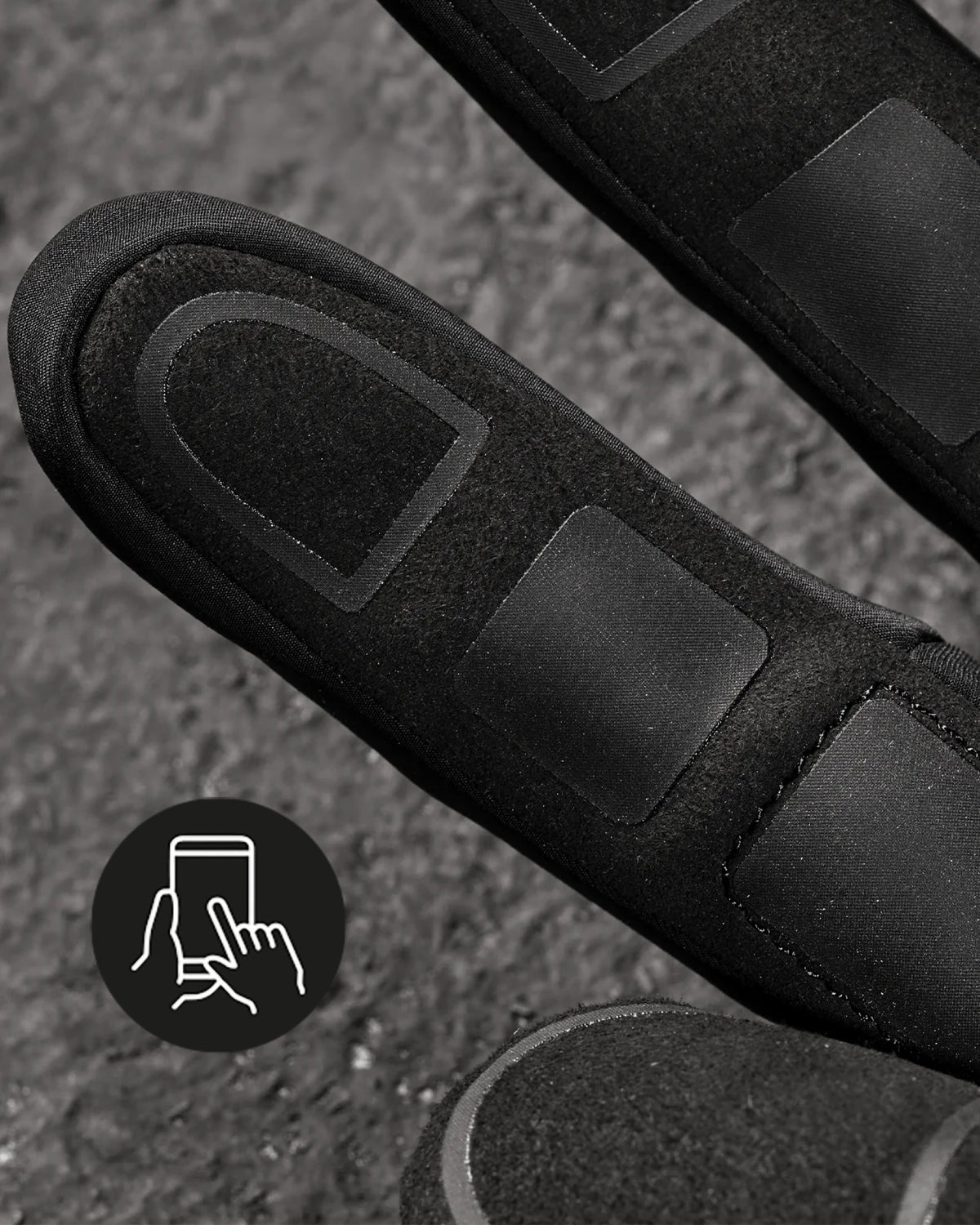 Close-up of the palm grip, fingers, and cuff on the black and basalt gray STRAUSS e.s.trail winter gloves.