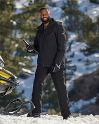 Lifestyle view of Functional Snow Pants e.s.trail pure in black during work