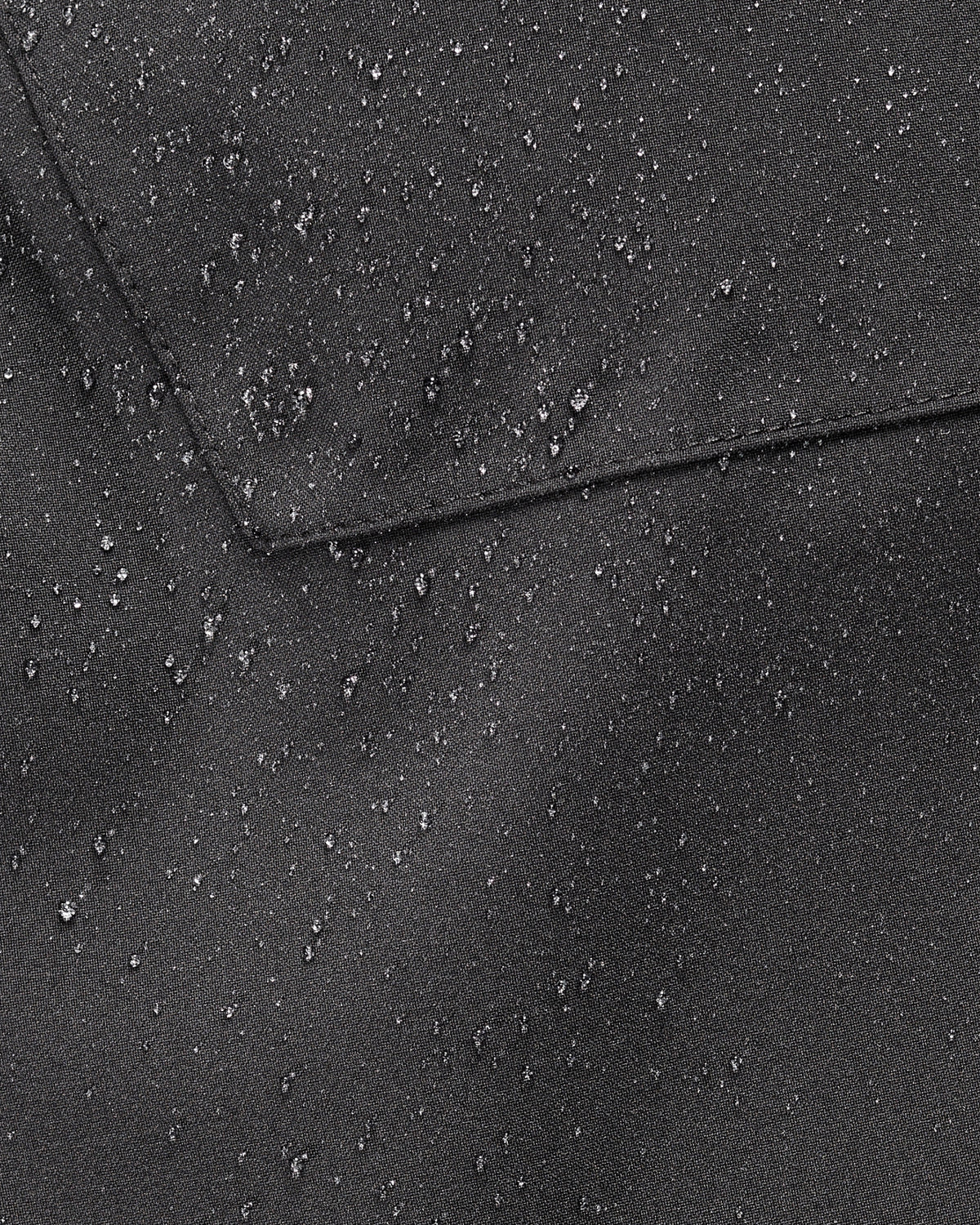 Close-up of weather-ready fabric on Functional Snow Pants e.s.trail pure in black