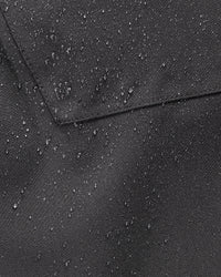 Close-up of weather-ready fabric on Functional Snow Pants e.s.trail pure in black