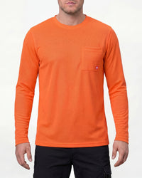 A model wears the STRAUSS Enhanced Visibility Performance Long Sleeve Shirt in neon orange with dark work pants and work boots in a studio product scene