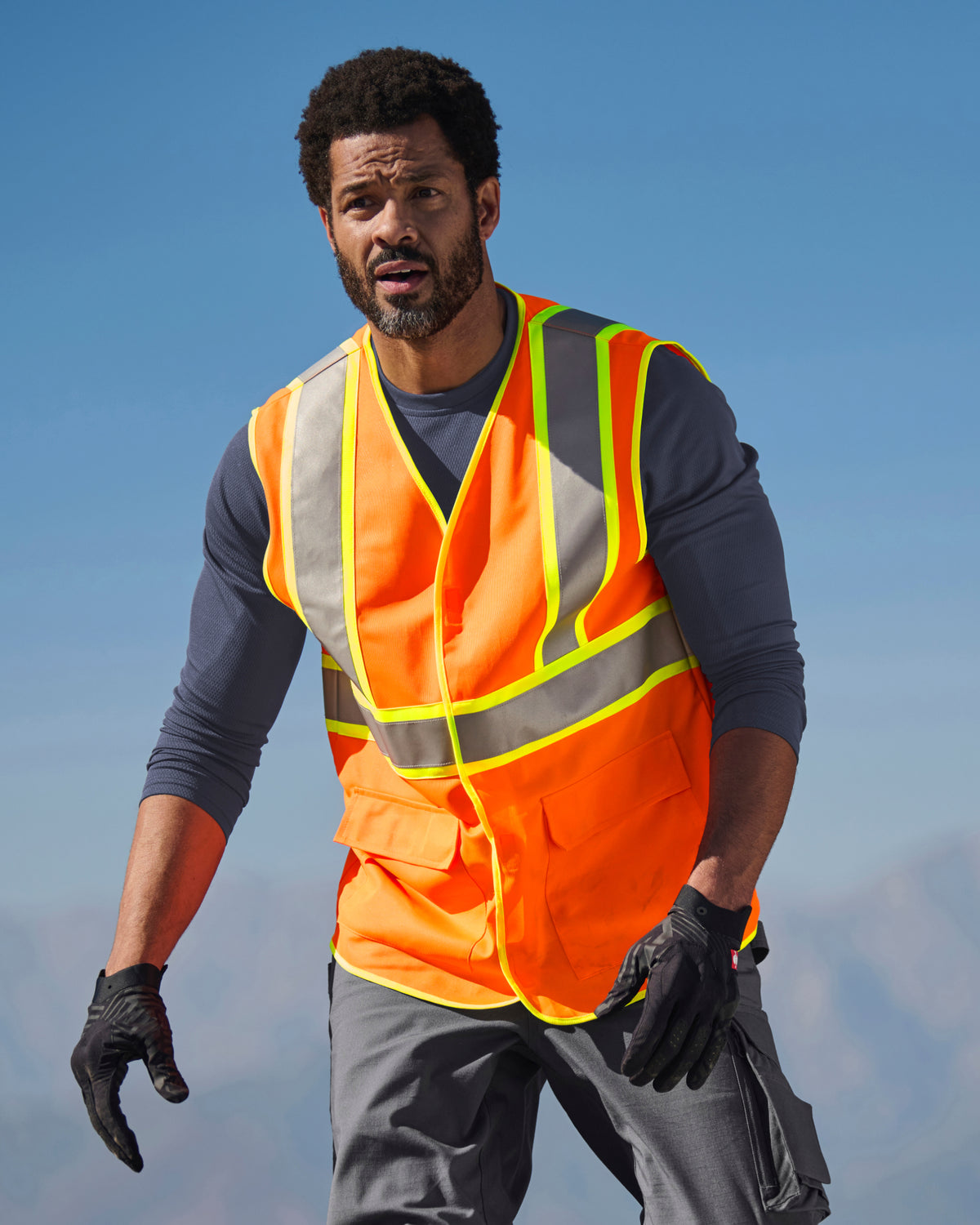 STRAUSS high visibility vest in neon orange worn for high-visibility work