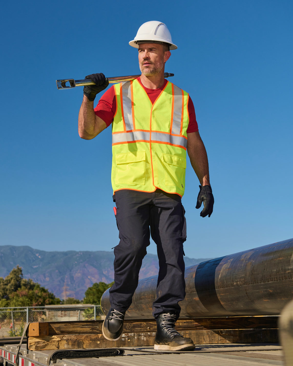 STRAUSS high visibility vest in neon yellow paired with work pants