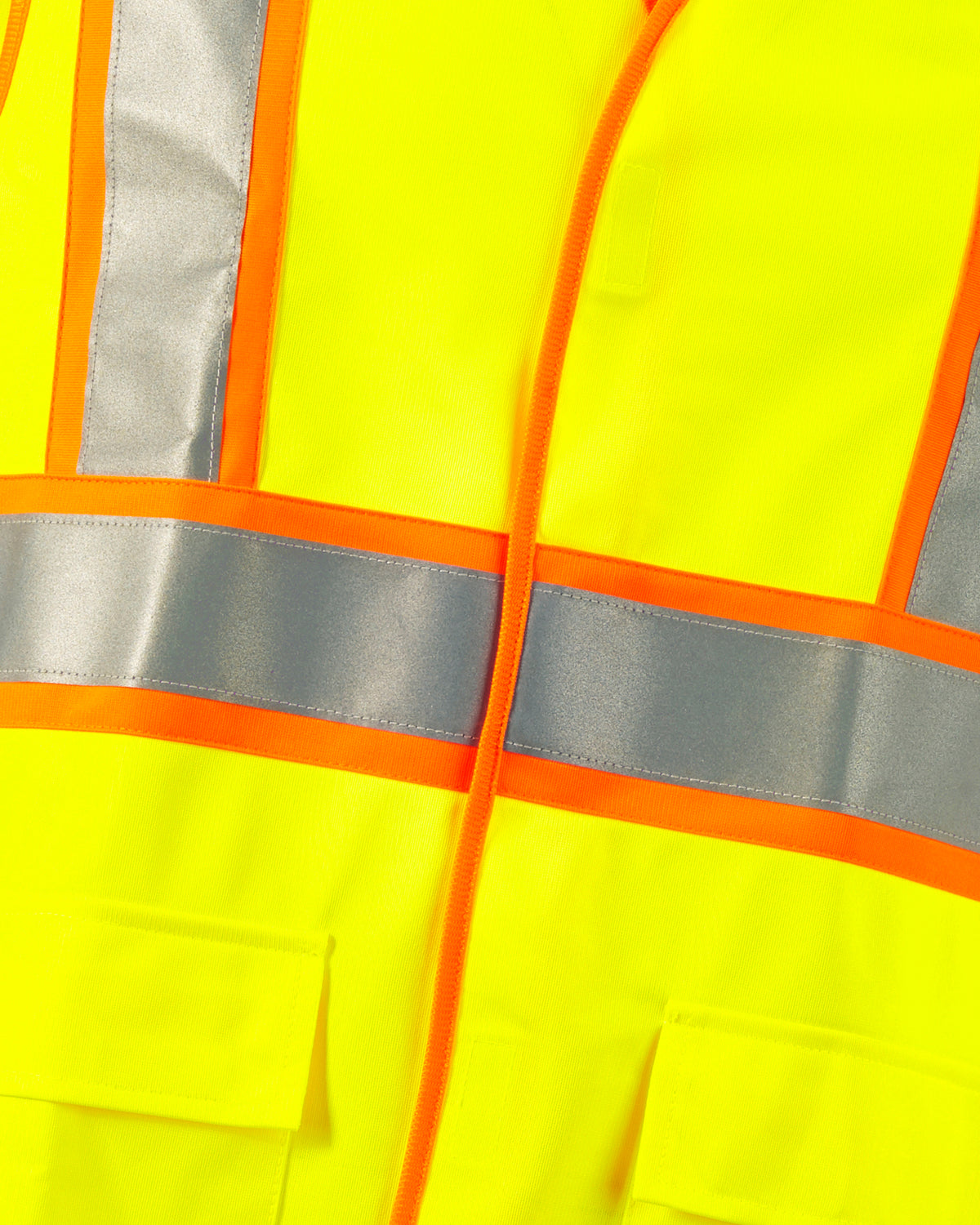 Close-up of reflective striping and shell details on STRAUSS high visibility vest in neon yellow