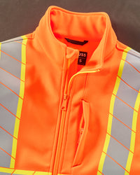 Close-up: reflective striping and shell details on STRAUSS Class 2 high visibility softshell jacket in neon orange and black