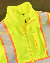 Close-up: reflective striping and shell details on STRAUSS Class 2 high visibility softshell jacket in neon yellow and black