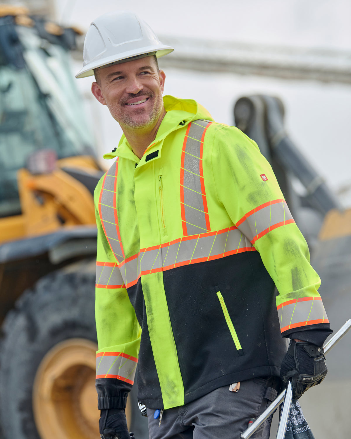 STRAUSS Class 2 high visibility waterproof jacket in neon yellow and black worn for high-visibility work