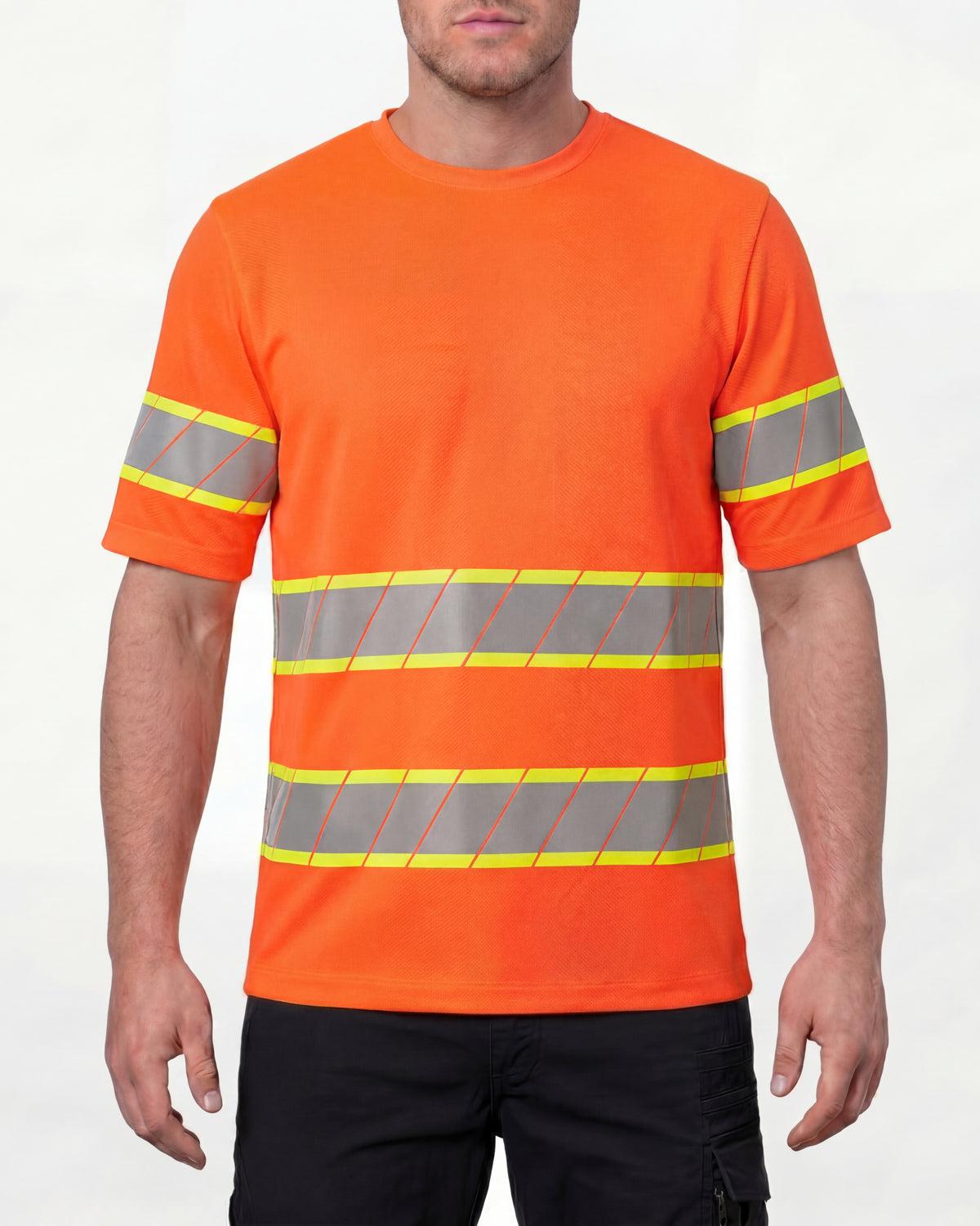 A model wears the STRAUSS Class 2 High Visibility T-Shirt in neon orange with dark work pants and work boots in a studio product scene