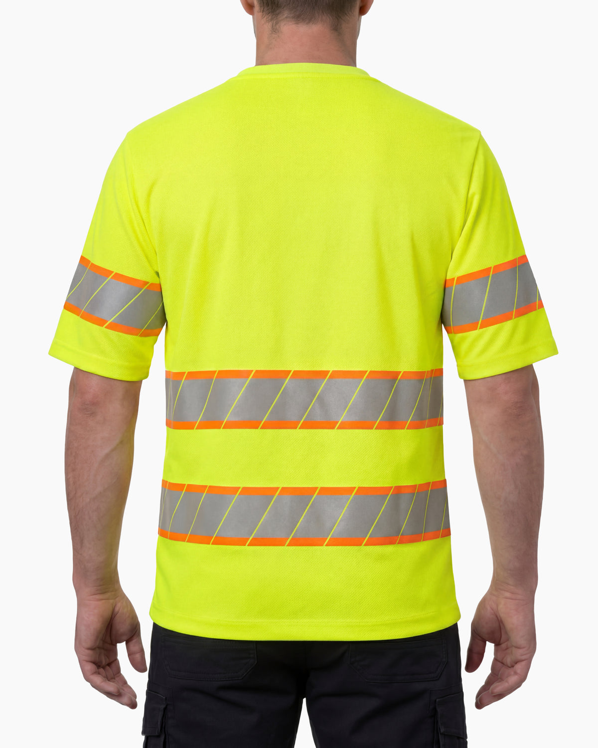 A model wears the STRAUSS Class 2 High Visibility T-Shirt in neon yellow with dark work pants and work boots, showing the shirt fit