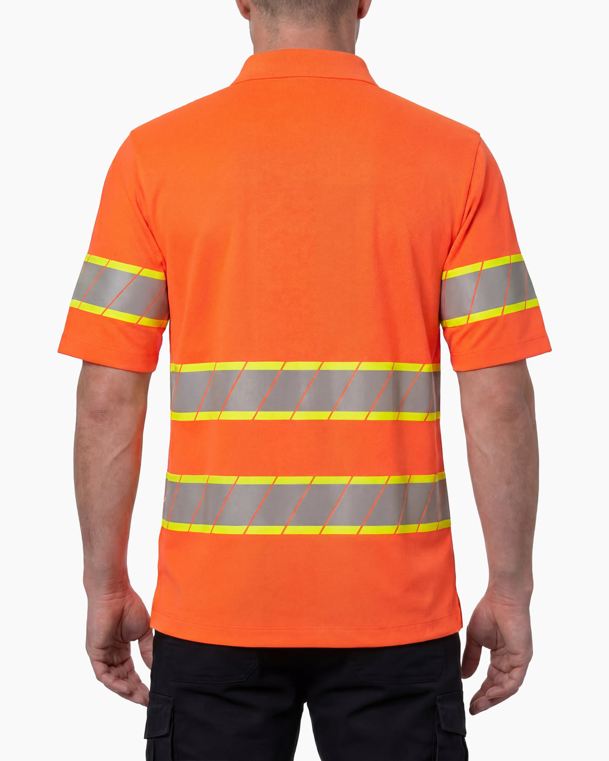 A model wears the STRAUSS Class 2 High Visibility Polo Shirt in neon orange with dark work pants and work boots, showing the shirt fit