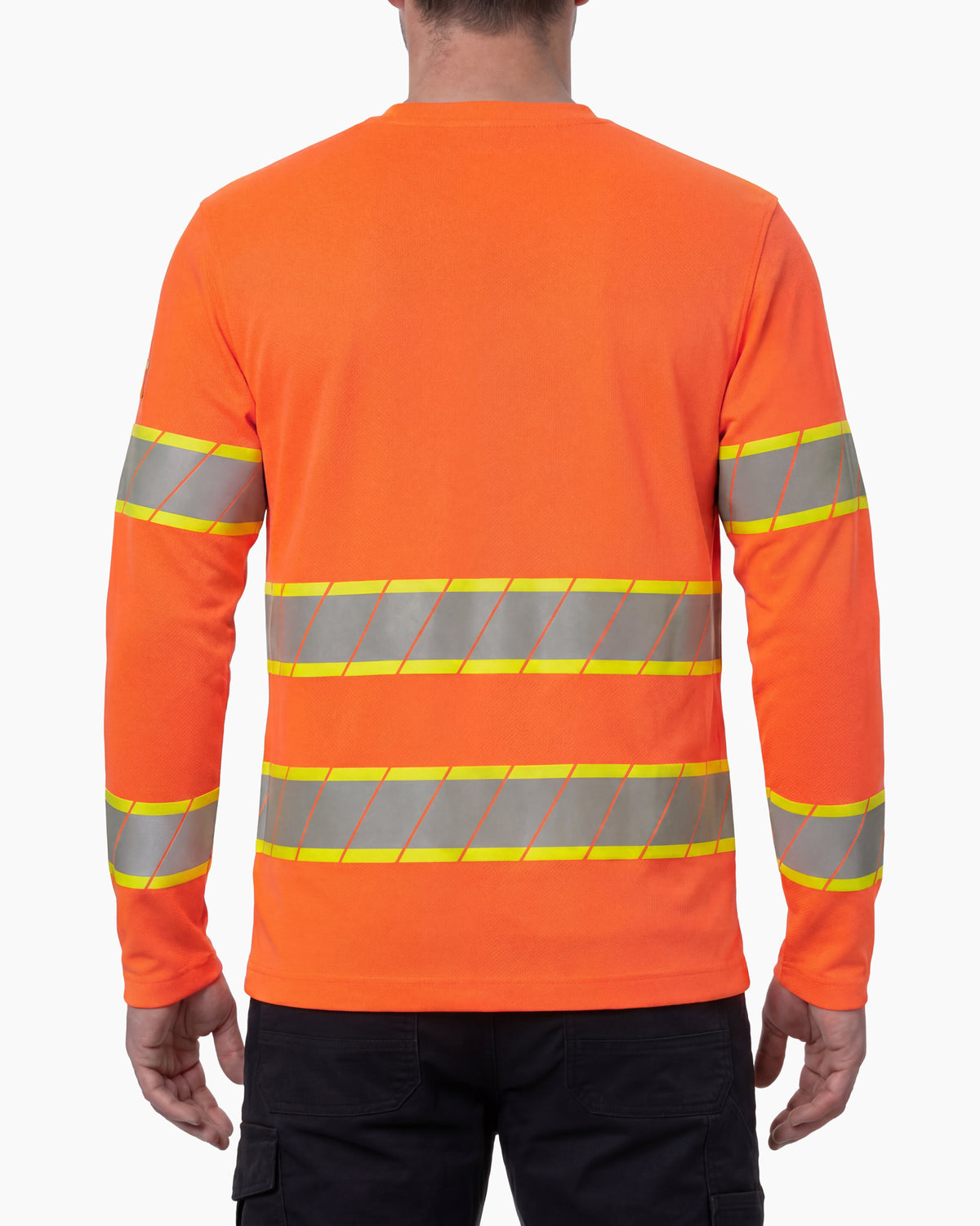 A model wears the STRAUSS Class 2 High Visibility Long Sleeve Shirt in neon orange with dark work pants and work boots, showing the shirt fit