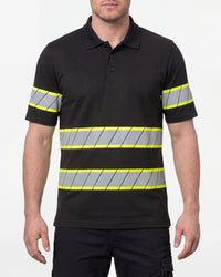 A model wears the STRAUSS Enhanced Visibility Polo Shirt in black with dark work pants and work boots in a studio product scene