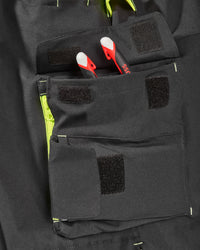 Close-up of reflective workwear details on Enhanced Visibility Work Pants in black