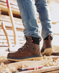 STRAUSS Ridgewood 6-inch Soft Toe Boot in Desert brown shown on rough jobsite ground