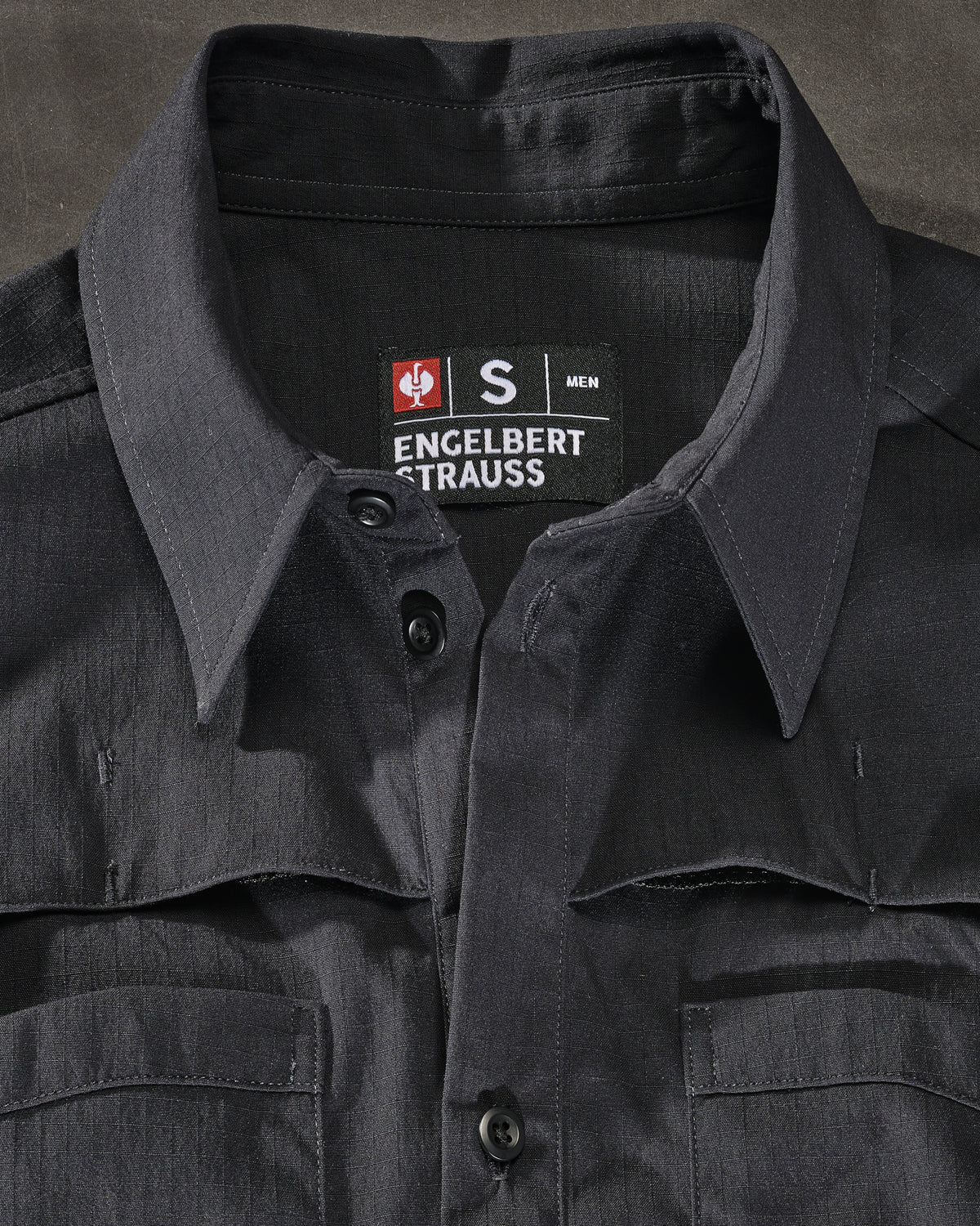 Chest pocket, snap placket, and stretch ripstop fabric on the STRAUSS e.s.taktik Stretch Ripstop Short Sleeve Work Shirt in black