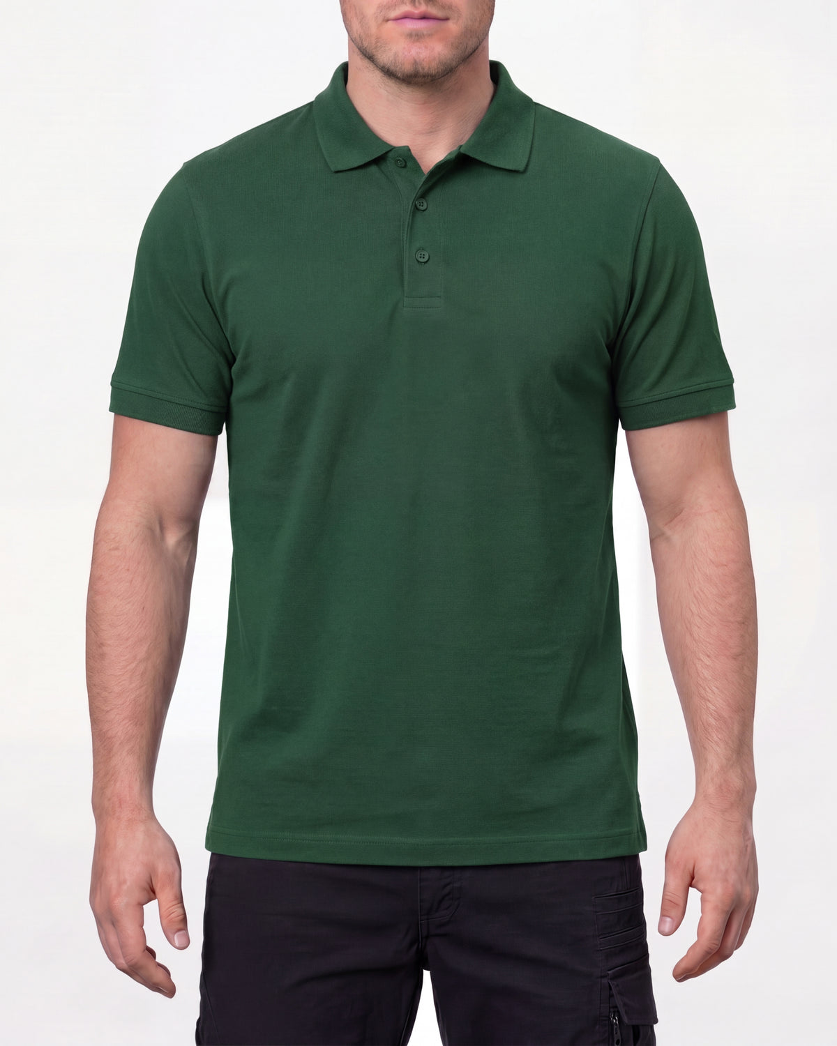 A model wears the STRAUSS Cotton Polo Shirt in green with tan work pants and work boots in a studio product scene